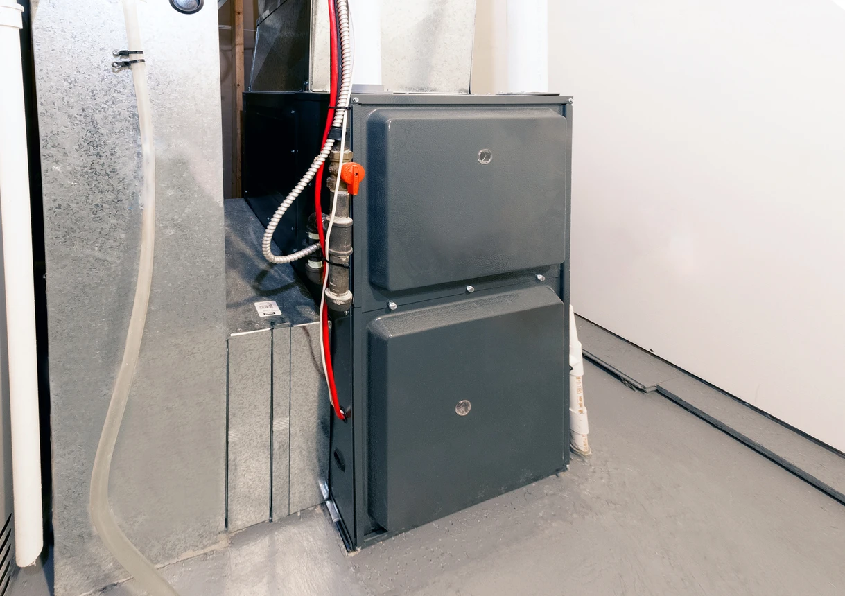 https://jonwayneheatingandair.com/wp-content/w3-webp/uploads/2023/11/high-energy-efficient-furnace-in-a-basement-img.jpgw3.webp